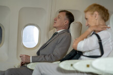 Businessman Are Sleep At Commercial Airplane On Their Seats During Flight.