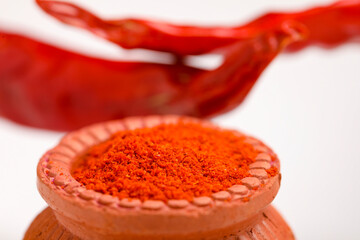 Wall Mural - Red chilli powder in a bowl with dry red chilli