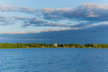 Poster - White clouds in the blue sky over the river. Summer bright day on vacation.