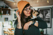 © Johnér - Young woman carrying cat on shoulder