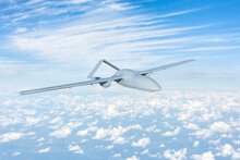 Unmanned Aerial Vehicle Flying High In The Sky Above The Clouds, Mission.