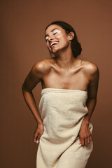 Wall Mural - cheerful woman dancing in bath towel
