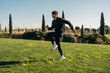 © ADDICTIVE STOCK - Active sportsman jumping during cardio training in park