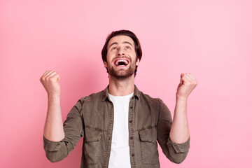 Sticker - Photo of young excited man happy positive smile celebrate victory win lottery lucky isolated over pink color background