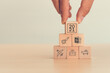 © Parradee - The hand put wooden block wording year 2021 with vaccination icon, travel icon, covid-19 vaccination certification. Target for travel and lifestyle concept after the people get covid-19 vaccination.