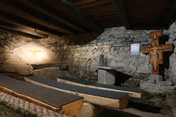 The fabulous alpine waterfalls of Riva in the Dolomites (Campo Tures). Chapel and crypt in the Tobl Castle ruins. Lovely place in the Alps. Sunny spring day with no people. Trentino Alto Adige.