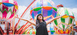 © chokniti - a beautiful asian girl enjoy her holiday at amusement park on a sunny day, nice clear sky, women wearing sunglasses, smiling girl, happy vacation