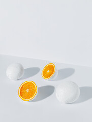 Wall Mural - Isometric view of fresh oranges painted in white isolated on a white background. Creative food concept. Abstract arty citrus fruit composition.