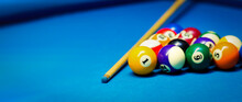 Billiard Pool Balls Rack And Cue On The Blue Cloth Table. Banner Copy Space
