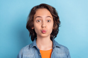 Sticker - Photo of young preteen boy pouted lips send air kiss you valentine day romantic isolated over blue color background