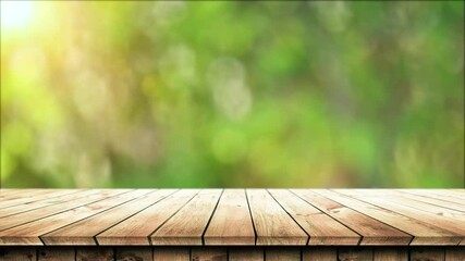 Wall Mural - Empty wooden table with fresh green bokeh background