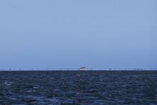 Fata Morgana ( Mirage) Of Coastline With Boat