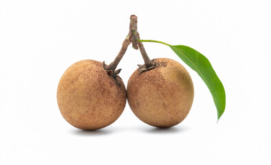 Fresh sapodilla plums with leaf isolated on white background.