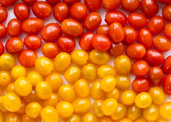 Wall Mural - High angle view of full frame image of bright red and yellow tomatoes.