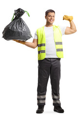 Wall Mural - Full length portrait of a waste collector in a uniform and gloves holding a bin bag and showing muscles