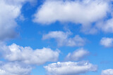 Fototapeta Na sufit - White cumulus clouds on blue sky background, natural phenomenon