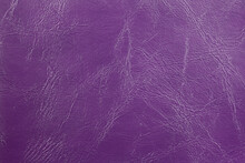 The Background Image Is Purple Leather With An Abstract Texture