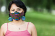 Latin America Bolivian woman with traditional pattern cloth mask. Handmade quechua native textile face mask for covid-19, coronavirus protection