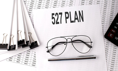 527 PLAN text on paper with chart and office tools , business concept