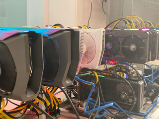 Fototapete - Row of bitcoin miners set up on the wired shelfs. Device for mining crypto currency. Mining cryptocurrency. Bitcoin farm. Machines for mining cryptocurrency bitcoin. Electronic device at day.