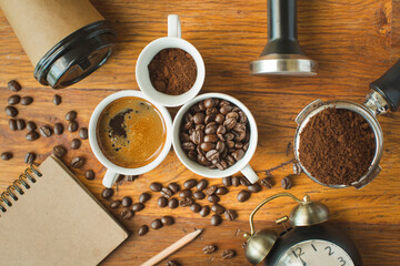 Coffee cup and beans on old kitchen table