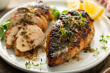 Wall Mural - Balsamic grilled chicken breast on a board