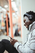 © Rawpixel.com - Happy man watching a video while riding the train
