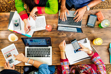 Group of Indian people are using computer laptop