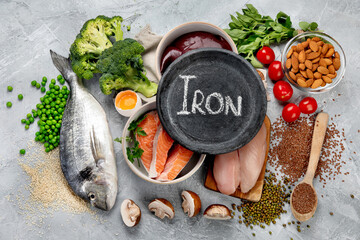 Wall Mural - Food high in iron on light gray background. Healthy eating concept.