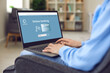 © Studio Romantic - Young businesswoman or student girl sitting in armchair at home using laptop to visit online bank website and open personal or business account. Hands and computer closeup. Safe money transfer concept