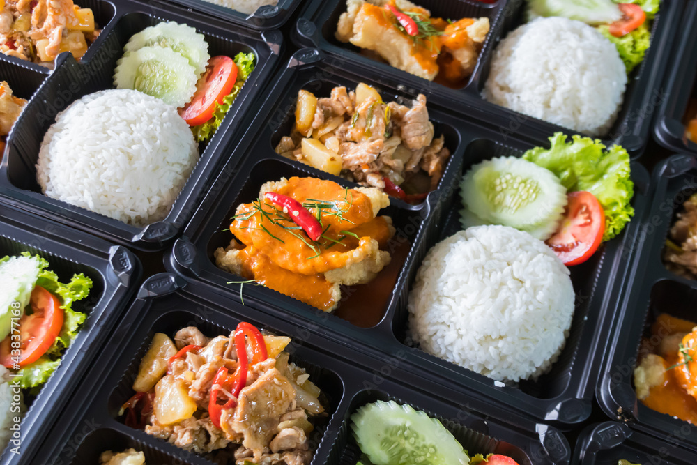Modern Thai food lunch boxes in plastic packages. Stock Photo | Adobe Stock