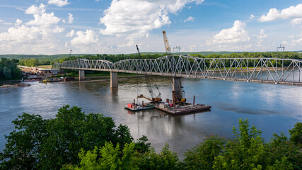 An old bridge over the Missouri River near Washington, MO being repaired.