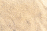 Fototapeta Miasto - Sand pattern texture for background. Brown desert pattern from tropical beach.