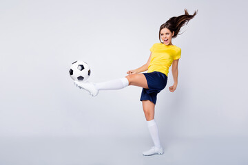 Wall Mural - Full size photo energetic professional soccer player girl play kick foot ball try score goal uefa world final cup championship scream wear white shoes kit cleats isolated grey color background