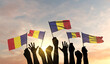 Silhouette of arms raised waving a Romania flag with pride. 3D Rendering