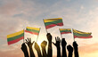 Silhouette of arms raised waving a Lithuania flag with pride. 3D Rendering