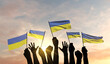 Silhouette of arms raised waving a Ukraine flag with pride. 3D Rendering