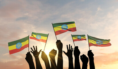 Wall Mural - Silhouette of arms raised waving an Ethiopia flag with pride. 3D Rendering