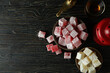 Concept of tasty food with turkish delight on wooden table