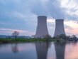 © wlad074 - Nuclear power plant against sky by the river at sunset