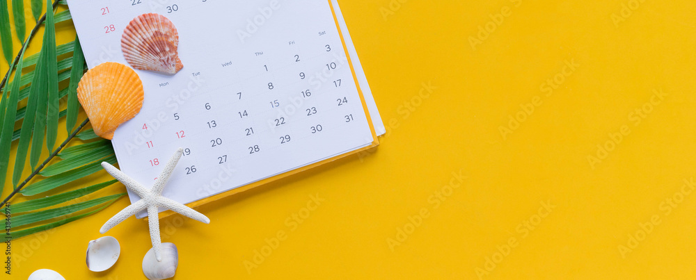 close up top view on white calendar with pencil and tropical leaves and shells on yellow table background for planning work and life balance in holiday summer concept - obrazy, fototapety, plakaty 