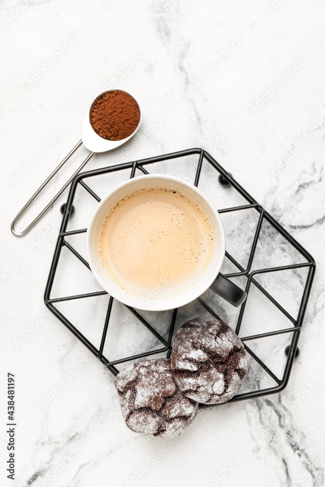 Cup of freshly brewed coffee on marble background