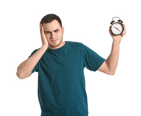 Sticker - Tired young man with alarm clock on white background