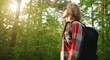 © M-Production - Man with backpack and sunglasses in the woods. Arc shoot.