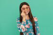 Happy tween girl smile wearing heart-shaped prop glasses for Valentines day party, February 14
