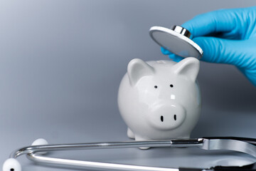 Wall Mural - Health check piggy bank with medical tools.concept of financial stability Build good immunity in investment..Prevent the loss of investment from the crisis caused by the coronavirus covid-19