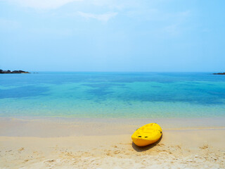 Wall Mural - Yellow Kayak boat on tropical island beach bright sun in summer. Koh Kood - Thailand