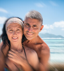 Wall Mural - Beautiful couple in 40s relaxing along La Digue rocks, Seychelle