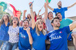 © william87 - Italian supporters celebrating at stadium with flags