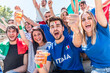 © william87 - Italian supporters celebrating at stadium with flags